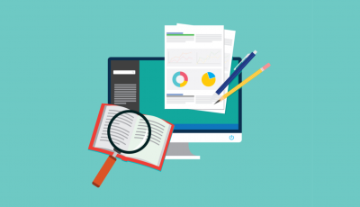 A computer screen with papers and pencils on it.